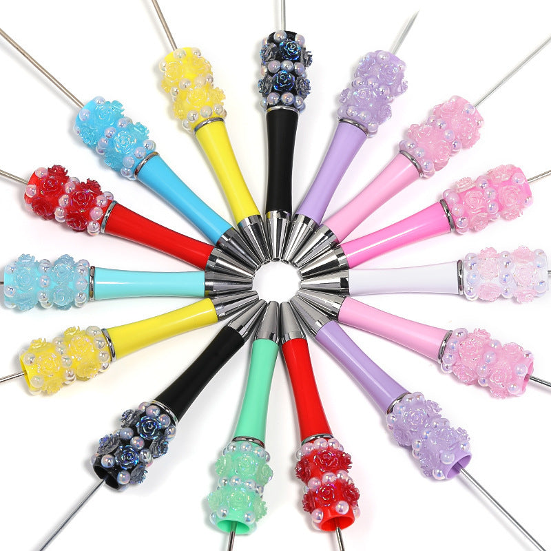 Flower-shaped rotating ballpoint pen with plastic beads