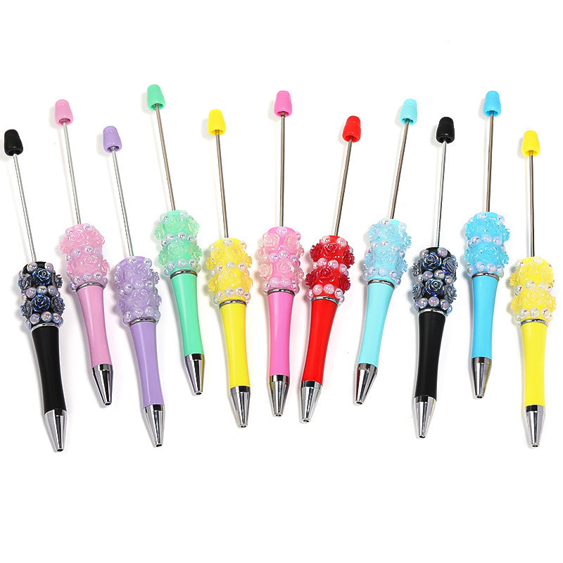 Flower-shaped rotating ballpoint pen with plastic beads
