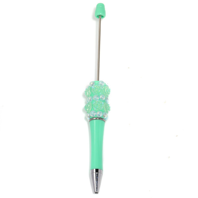 Flower-shaped rotating ballpoint pen with plastic beads
