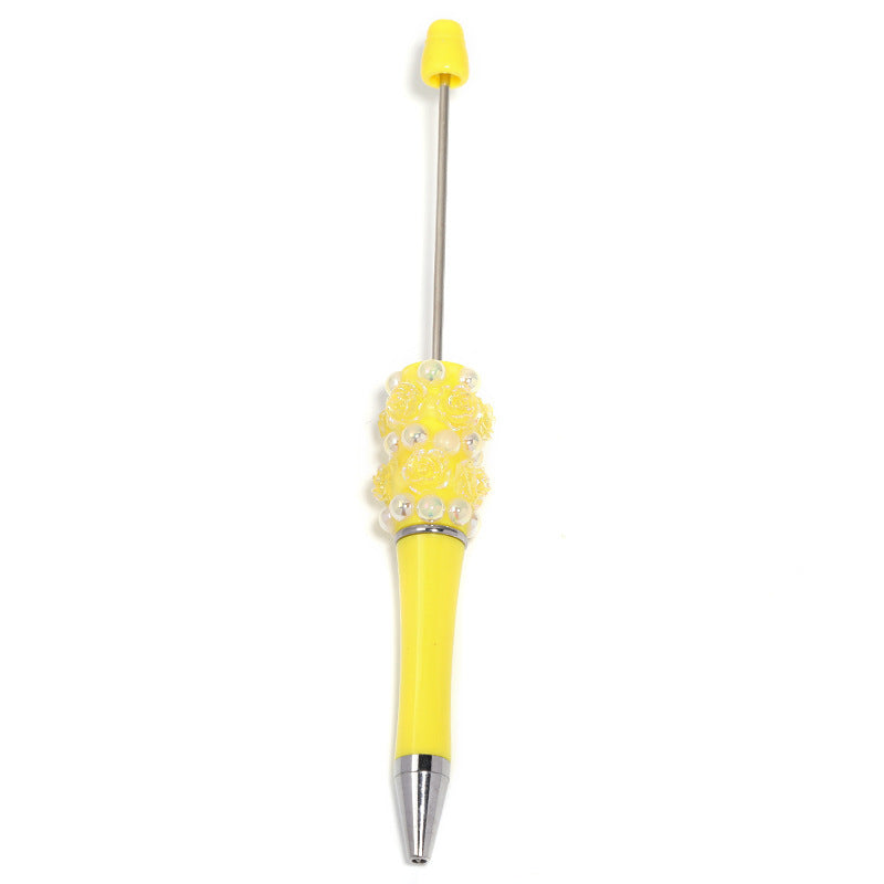 Flower-shaped rotating ballpoint pen with plastic beads