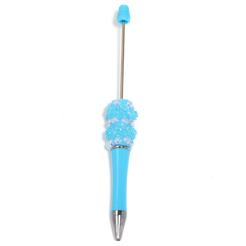 Flower-shaped rotating ballpoint pen with plastic beads