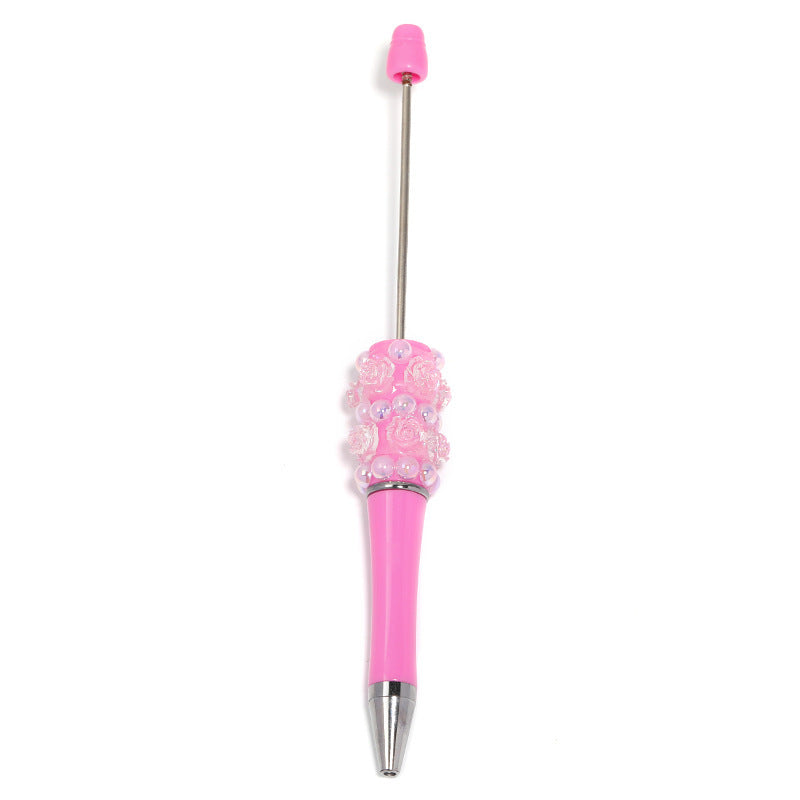 Flower-shaped rotating ballpoint pen with plastic beads