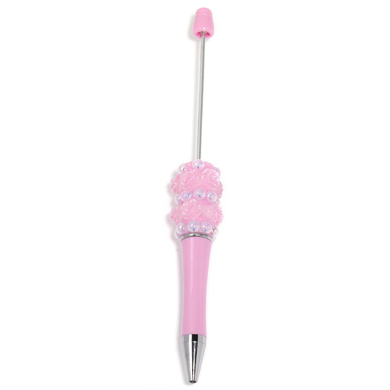 Flower-shaped rotating ballpoint pen with plastic beads