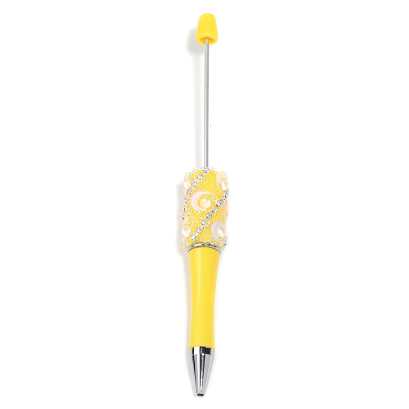 Crescent-shaped multi-colored plastic rotating ballpoint pen with refillable ink cartridge