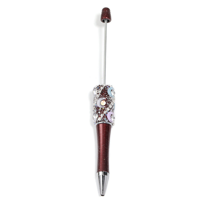 Crescent-shaped multi-colored plastic rotating ballpoint pen with refillable ink cartridge