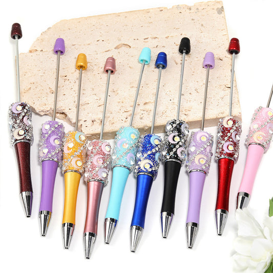 Crescent-shaped multi-colored plastic rotating ballpoint pen with refillable ink cartridge