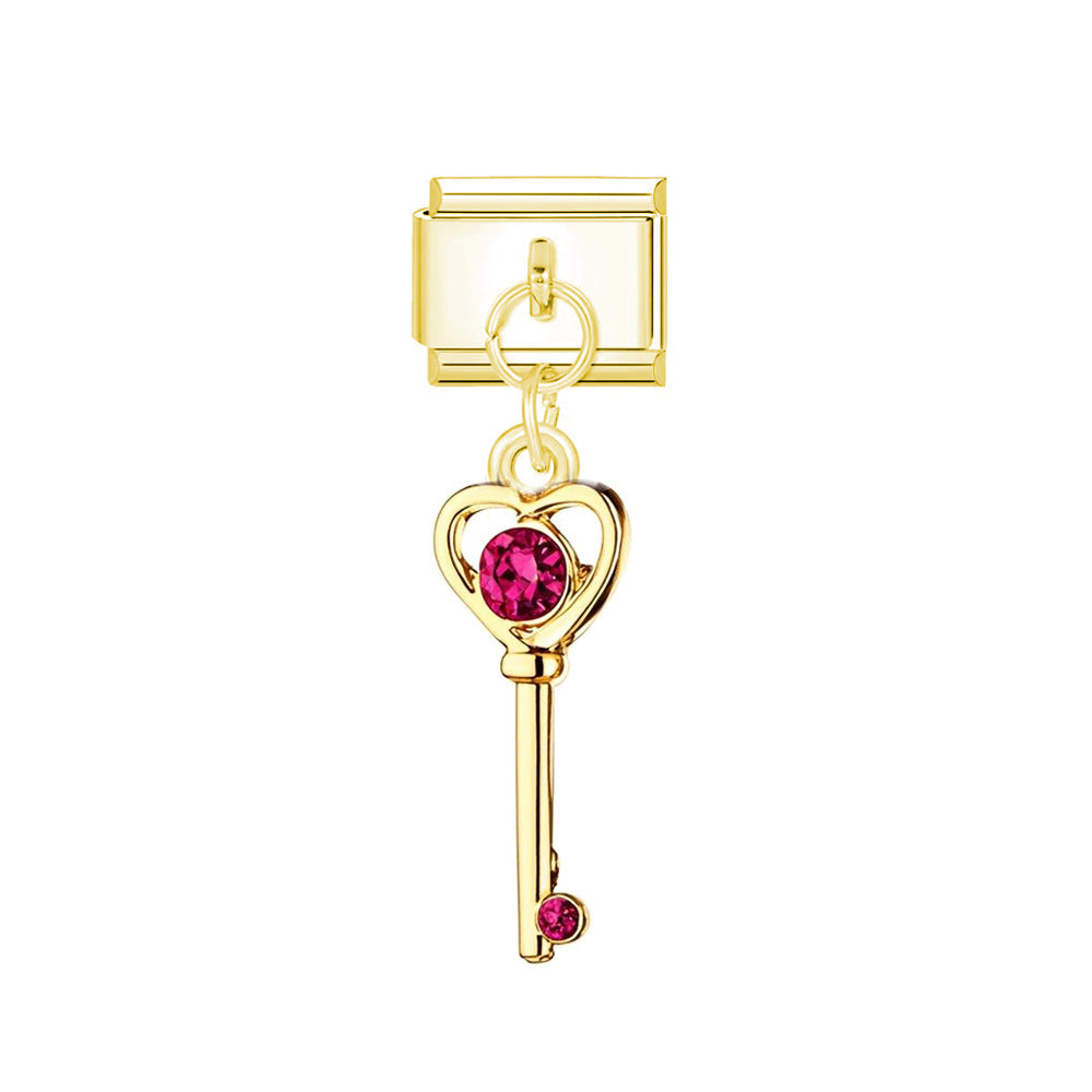 golden red key charm