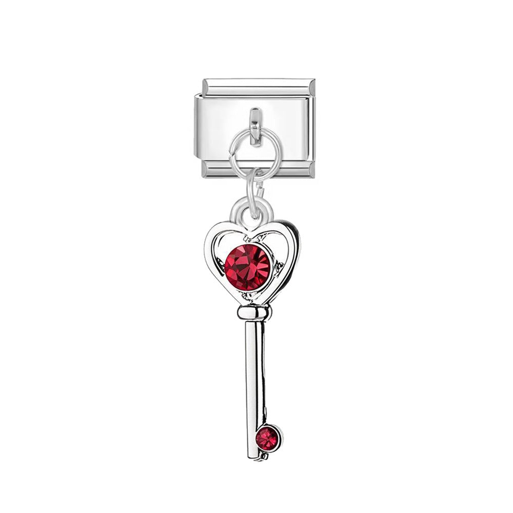silvery red key charm